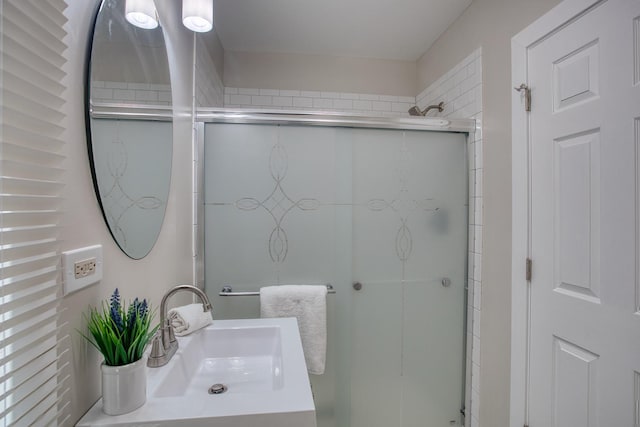 full bathroom with vanity and a stall shower