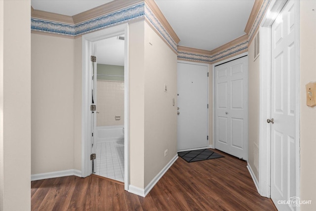 hallway with baseboards and wood finished floors