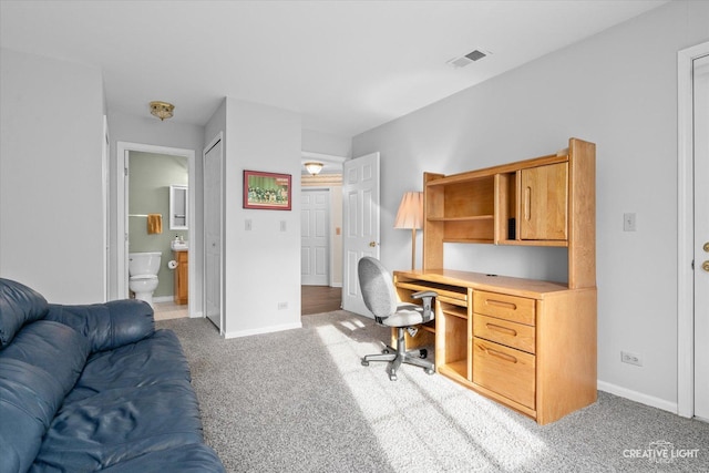 office area featuring carpet flooring, baseboards, and visible vents