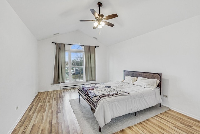 bedroom featuring visible vents, ceiling fan, lofted ceiling, and wood finished floors