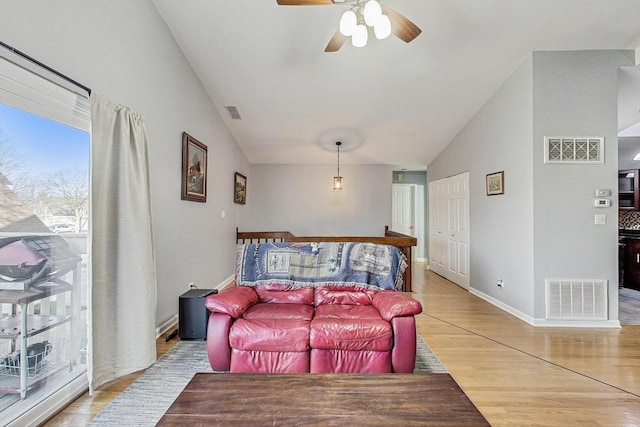 living area with a ceiling fan, light wood-style flooring, baseboards, and visible vents