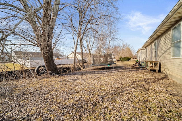 view of yard with a trampoline