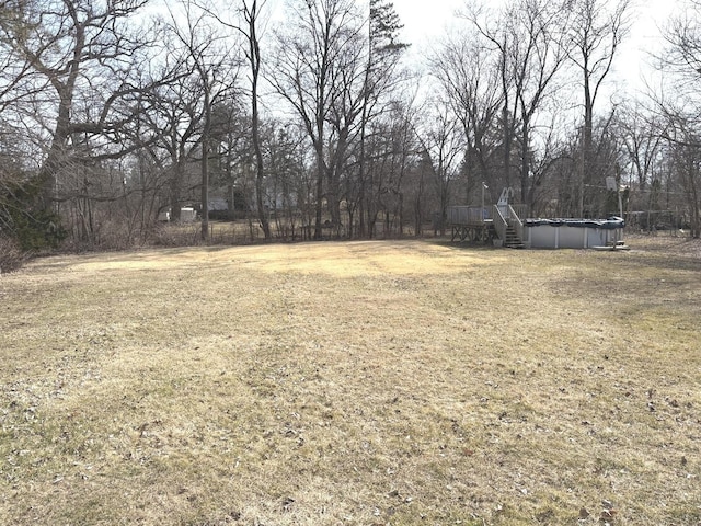 view of yard with an outdoor pool