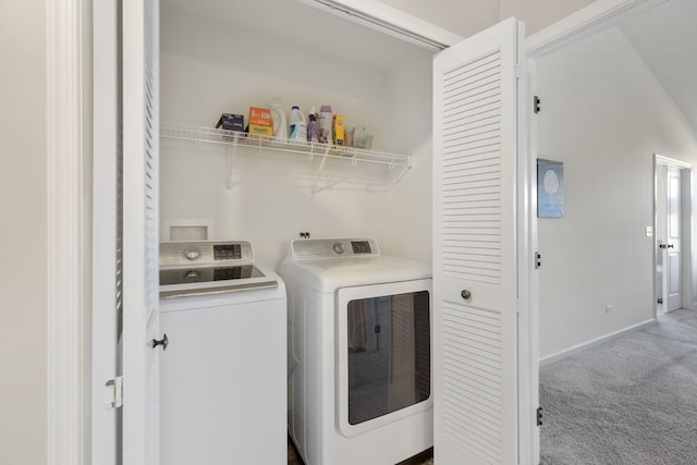 laundry area with washer and clothes dryer, laundry area, baseboards, and carpet