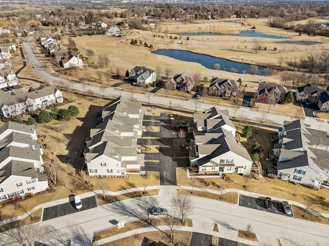 drone / aerial view with a residential view and a water view