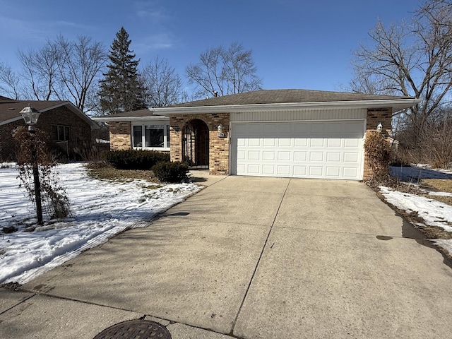 ranch-style home with concrete driveway, an attached garage, and brick siding