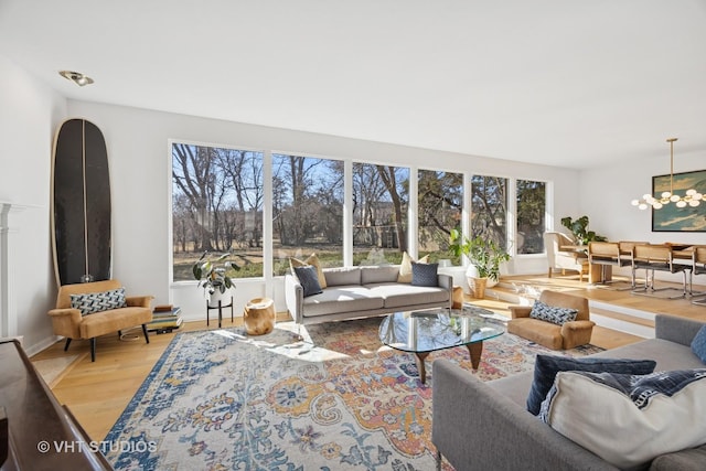 living area featuring baseboards and wood finished floors