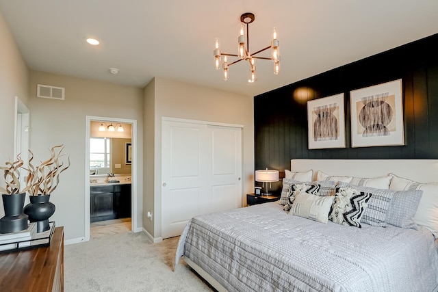 bedroom with a chandelier, light colored carpet, visible vents, baseboards, and a closet