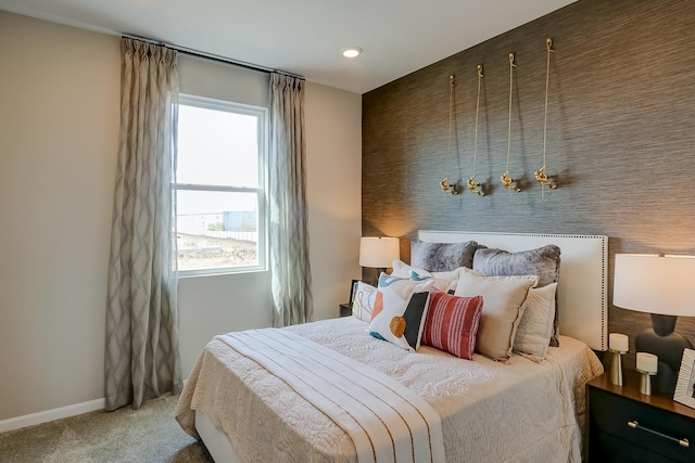 bedroom featuring baseboards and carpet flooring