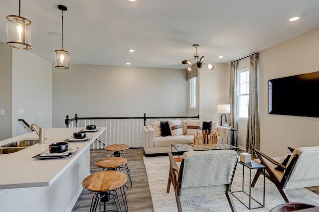 living area featuring light wood-style floors and recessed lighting