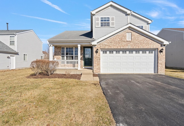 traditional-style home with a front yard, a porch, an attached garage, aphalt driveway, and brick siding