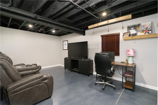 office area with baseboards and finished concrete floors