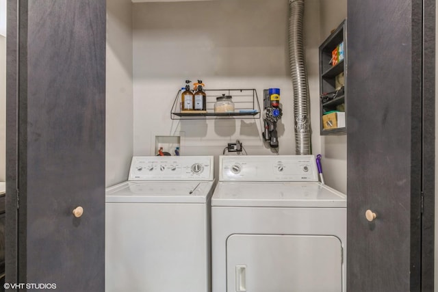 laundry room featuring washer and dryer and laundry area