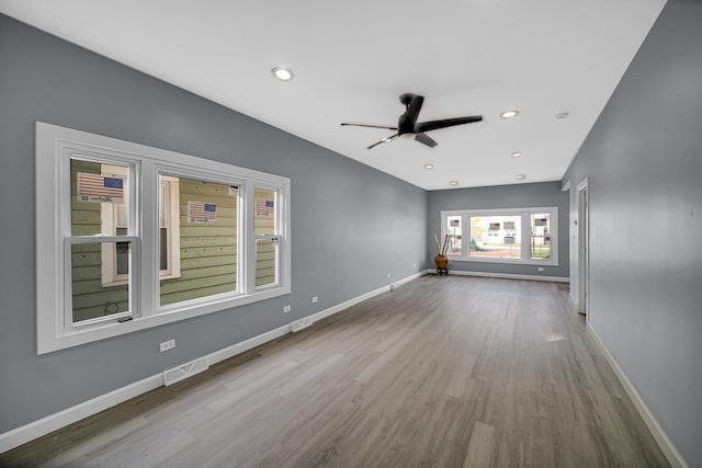 unfurnished room with recessed lighting, visible vents, baseboards, and wood finished floors