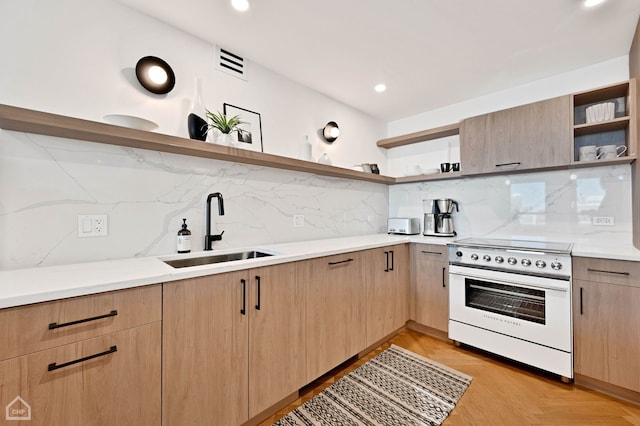 kitchen featuring a sink, open shelves, light brown cabinets, and white range with electric stovetop