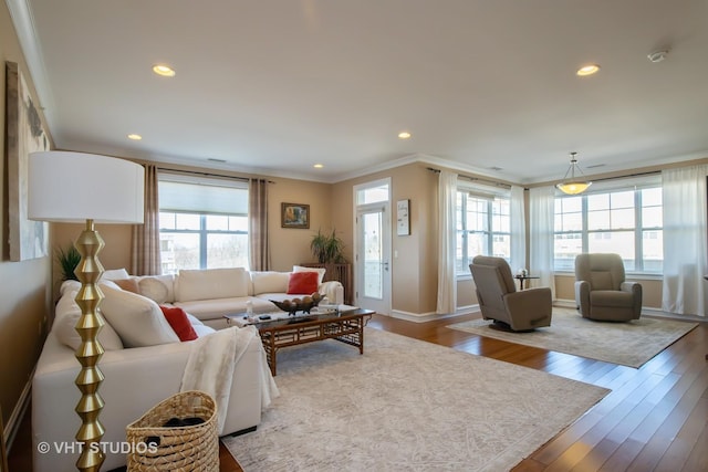 living area with recessed lighting, baseboards, ornamental molding, and hardwood / wood-style flooring