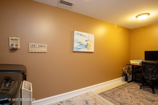 office space featuring visible vents and baseboards