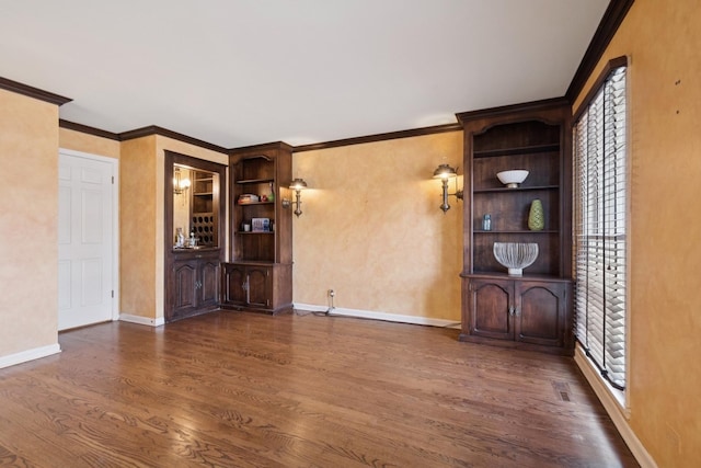 unfurnished living room featuring dark wood-type flooring, baseboards, and ornamental molding