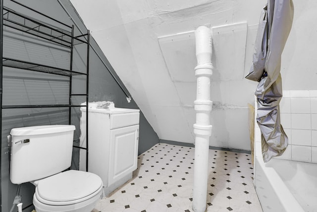 full bath featuring vanity, toilet, and tile patterned floors