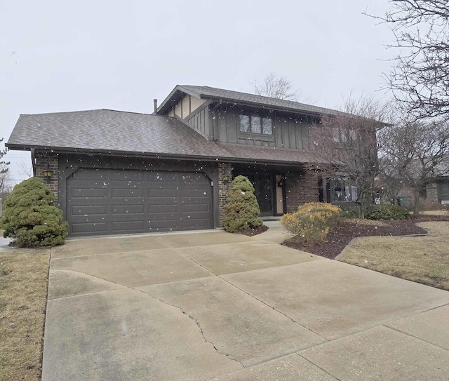 view of front of house with brick siding, roof with shingles, concrete driveway, and an attached garage