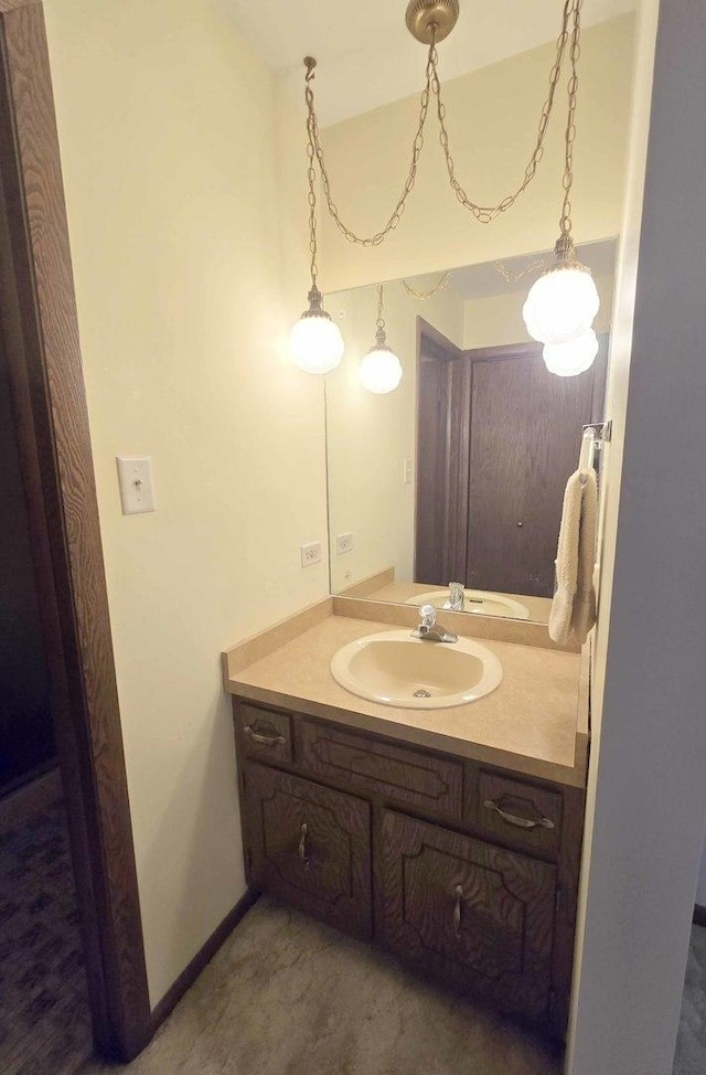 bathroom featuring vanity and baseboards