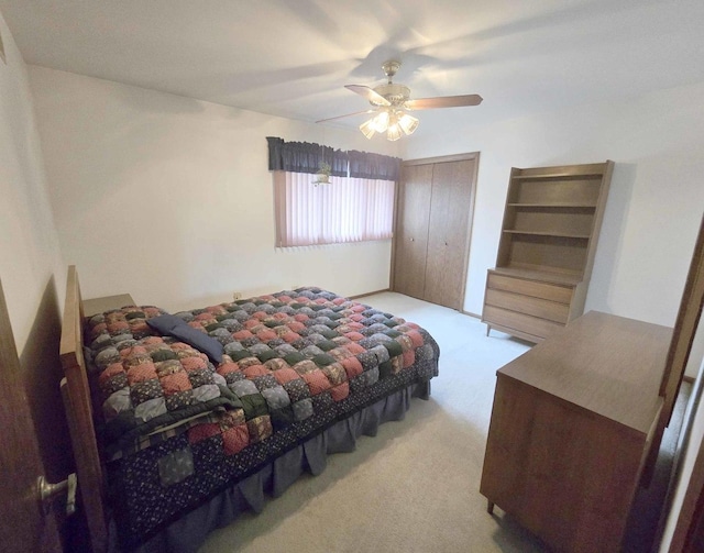 bedroom featuring a closet, ceiling fan, and carpet