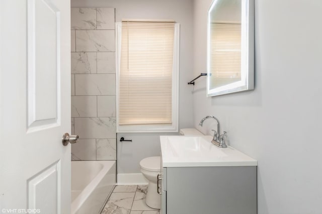 bathroom with vanity, toilet, baseboards, and marble finish floor