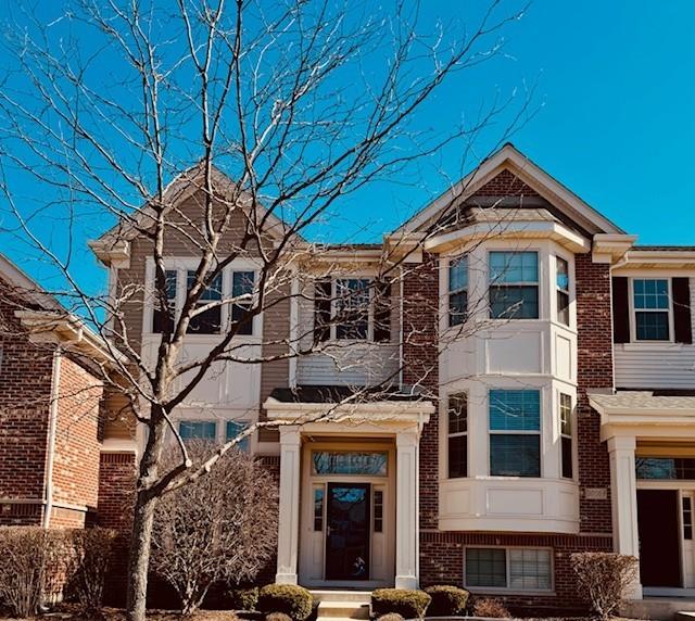 view of front of property with brick siding