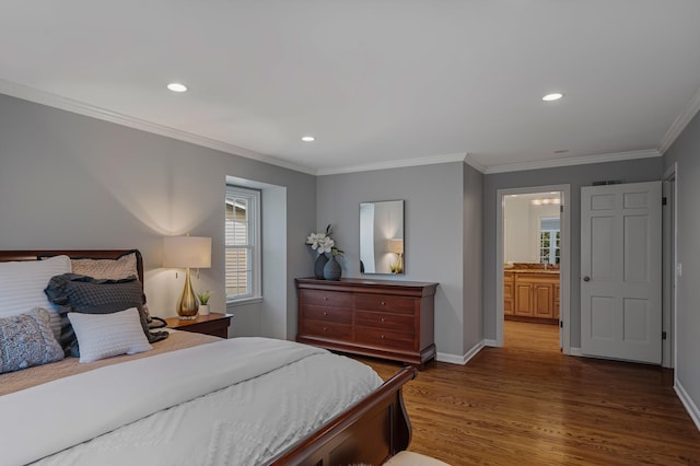 bedroom featuring recessed lighting, wood finished floors, baseboards, and ornamental molding