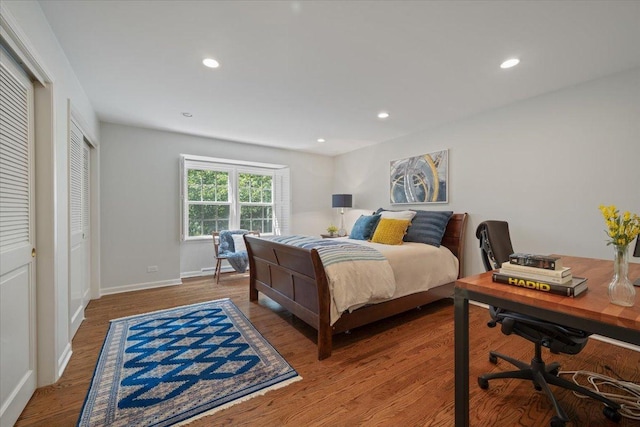 bedroom featuring recessed lighting, wood finished floors, and baseboards