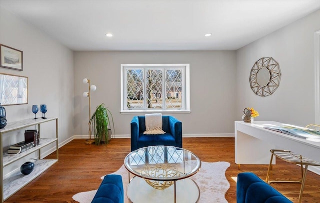 interior space featuring recessed lighting, wood finished floors, and baseboards