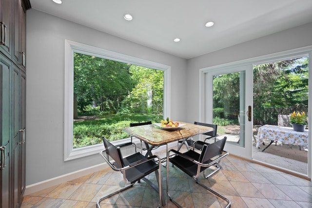 dining space with light tile patterned floors, recessed lighting, and baseboards