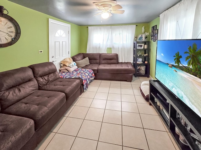 living area with ceiling fan and tile patterned floors