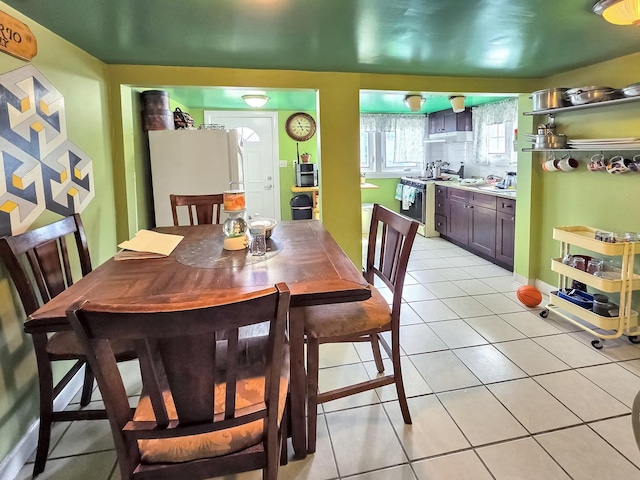 dining room featuring light tile patterned floors