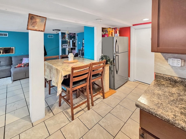 dining space featuring light tile patterned floors, visible vents, and recessed lighting