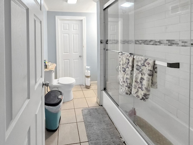 full bathroom with toilet, tile patterned flooring, combined bath / shower with glass door, and crown molding