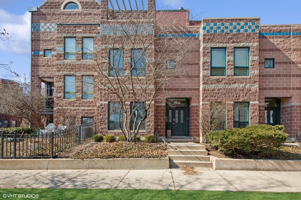 5342 S Ingleside Ave, Chicago, IL 60615 - view of front of home featuring brick siding and fence