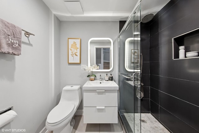 bathroom featuring vanity, a shower stall, toilet, and tile patterned flooring