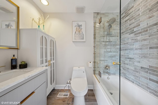 bathroom with visible vents, toilet, shower / washtub combination, and vanity