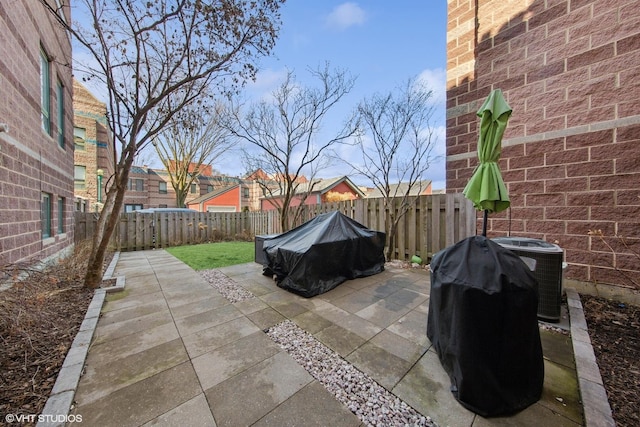 view of patio / terrace with central AC and a fenced backyard