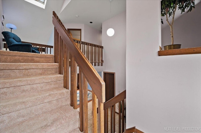 stairway with a towering ceiling