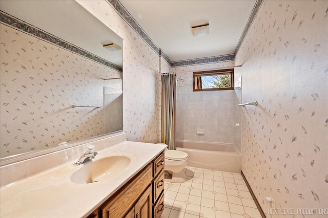 bathroom with vanity, toilet, bathing tub / shower combination, and wallpapered walls