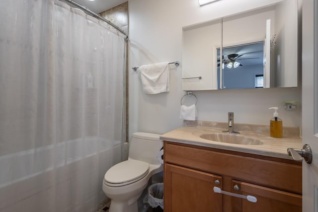 bathroom with ceiling fan, vanity, toilet, and shower / bath combo with shower curtain