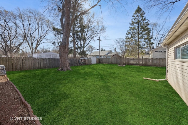 view of yard with a fenced backyard