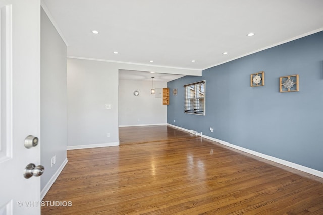 unfurnished room with recessed lighting, baseboards, wood finished floors, and ornamental molding