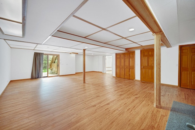 unfurnished living room featuring light wood-style flooring, baseboards, and recessed lighting