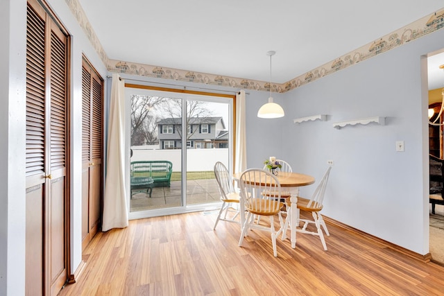 dining space with light wood-style floors