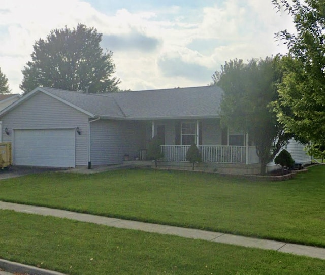 ranch-style home with a garage, covered porch, driveway, and a front yard