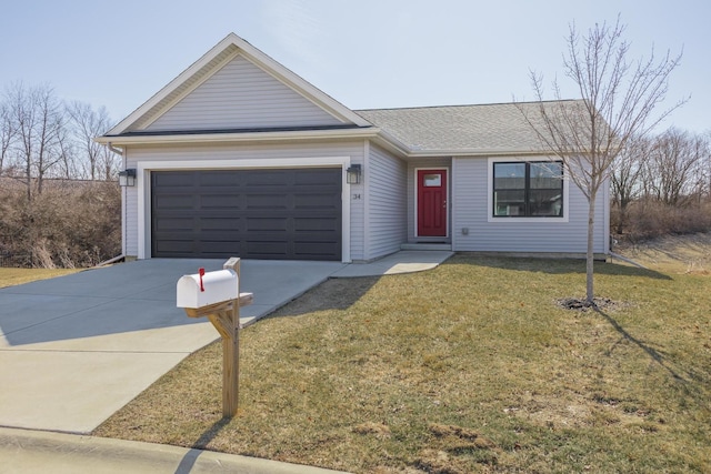 ranch-style home featuring a front yard, an attached garage, and driveway