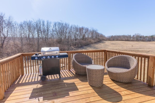 wooden terrace with a grill